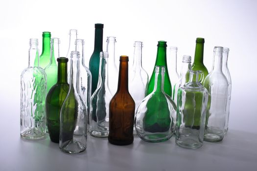 color glass bottles on the white background