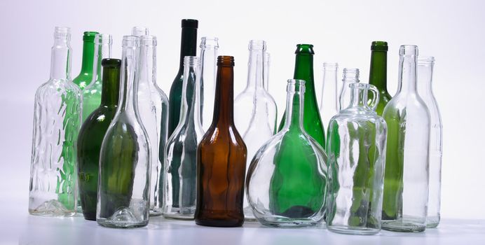 color glass bottles on the white background