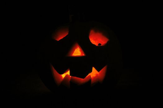 halloween pumpkin with light in the dark night 