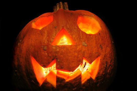 halloween pumpkin with light in the dark night 