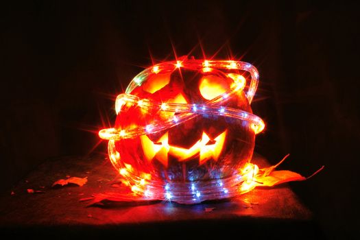 pumkin with ligths in dark halloween symbol