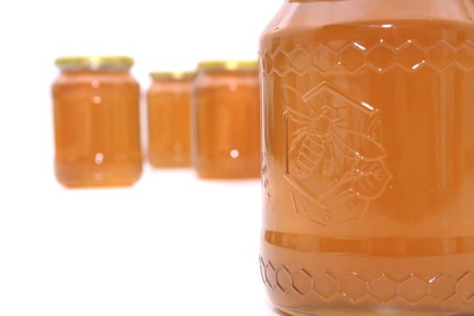 fresh honey isolated on the white background