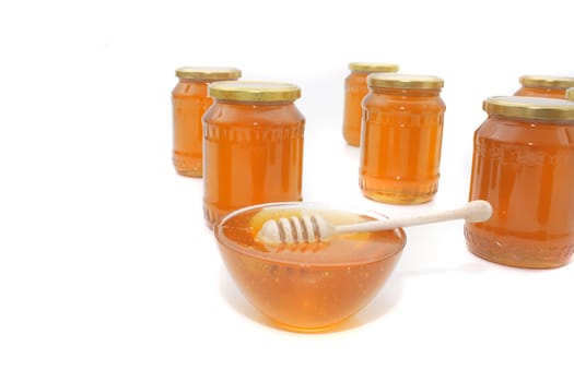 fresh honey isolated on the white background