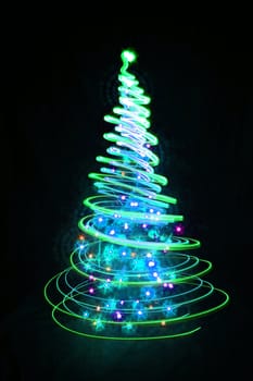 christmas tree form the color lights on the black background