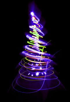 christmas tree form the color lights on the black background