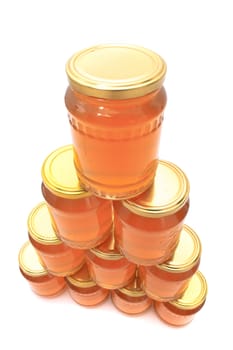 glass with honey isolated on the white background