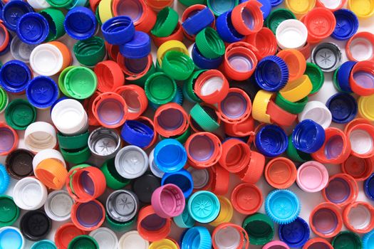 rainbow background from different colors plastic caps 