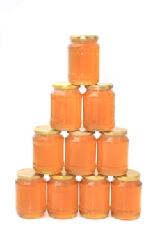 honey in glasses isolated on the white background