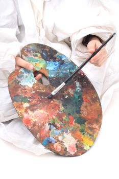 color pallete and artist hands isolated on white background