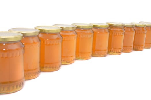 glasses of honey isolated on the white background