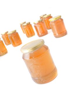 glasses of honey isolated on the white background