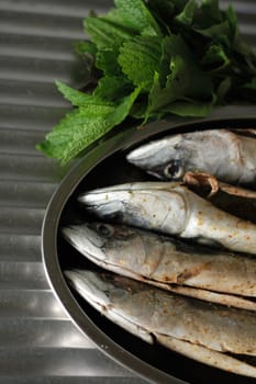 macrela fishes are being prepared for grill
