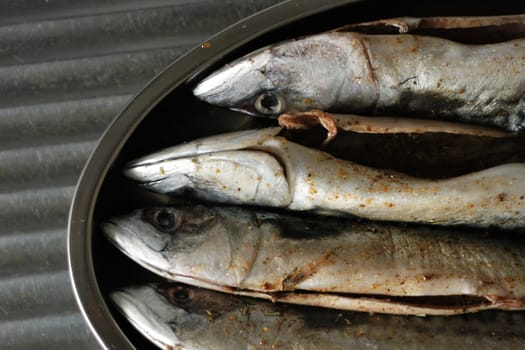 macrela fishes are being prepared for grill