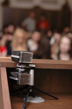 microphone in the hall full of people 