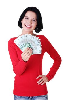 Cheerful young lady holding cash - polish zloty ( pln )