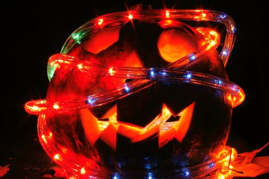 halloween pumkin in the dark night with color lights