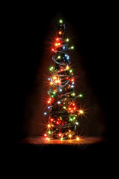 christmas bottle with color lights in the dark night