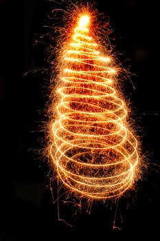 christmas tree from the sparklers in the dark night