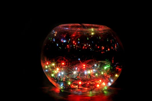 christmas glass sphere with color lights in the dark night