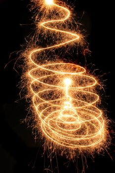 christmas tree from the sparklers in the dark night