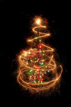 christmas tree from the sparklers in the dark night