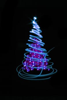 christmas tree form the color lights on the black background