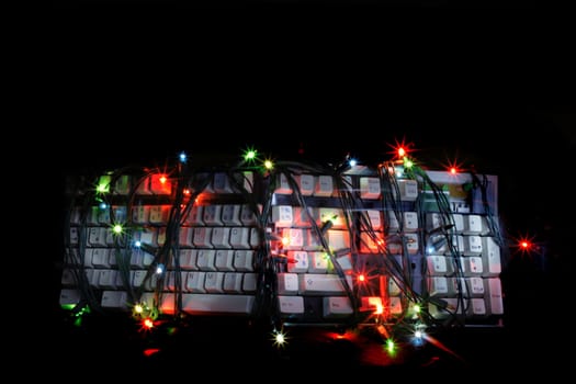 christmas keyboard in the dark night with the color lights 