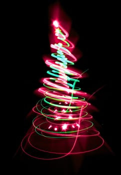 christmas tree form the color lights on the black background