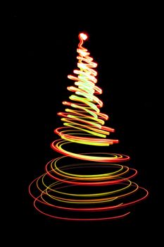 christmas tree form the color lights on the black background