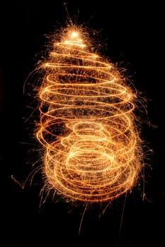 christmas tree from the sparklers in the dark night