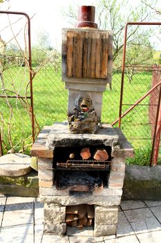 home made outdoor fireplace in the garden 