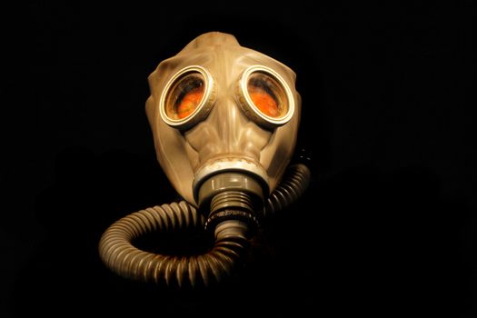 old gas mask isolated on the black background