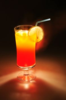 fresch orange and lemon drink in the dark night