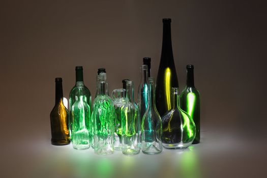 empty color glass bottles in the dark night
