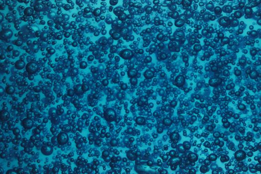 natural blue water background with oxygen bubbles