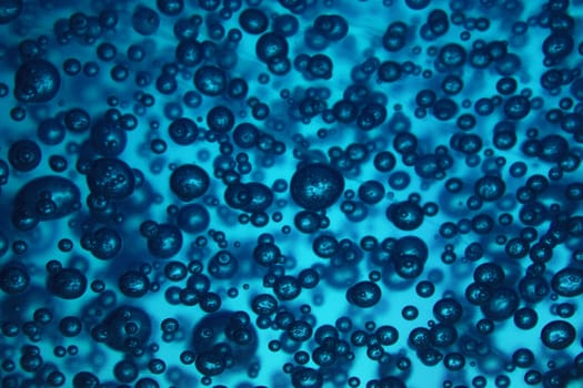 natural blue water background with oxygen bubbles
