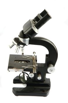 old microscope isolated on the white background