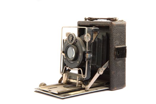 old  photo camera isolated on the white background