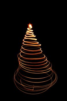 christmas tree as easy light shape isolated on the black background