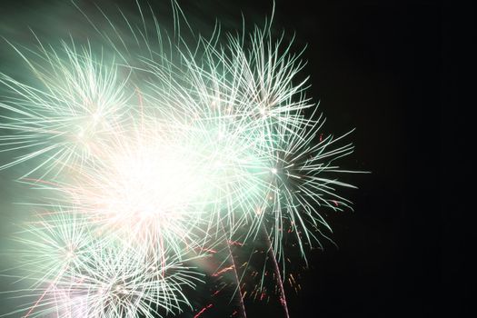 color fireworks in the dark night as holiday background