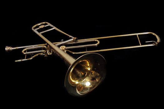old golden trumpet isolated on the black background