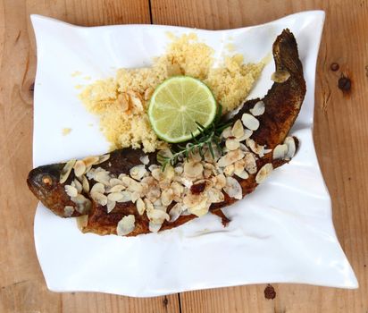 baked trout fishes with almond as typical czech food