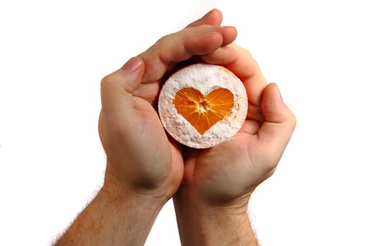 orange heart in human hands isolated on the white background