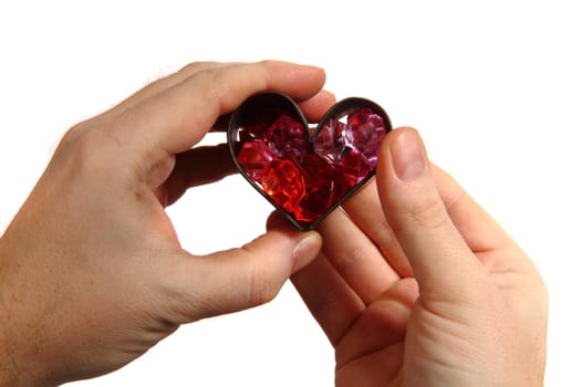 red heart in human hands isolated on the white background