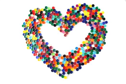 heart from the color plastic caps isolated on the white background