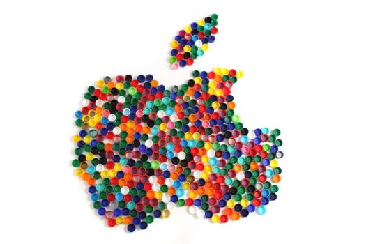 apple from the color plastic caps isolated on the white background