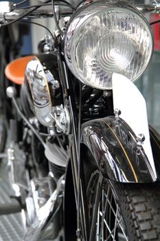 detail of old motorbike in the black and silver colors 