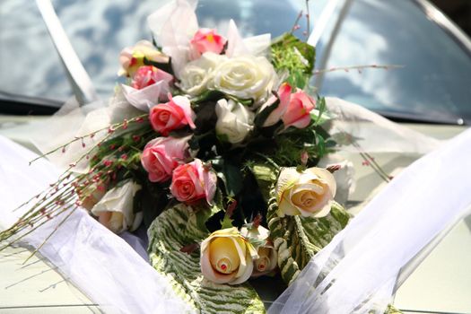 wedding flower background on the white car