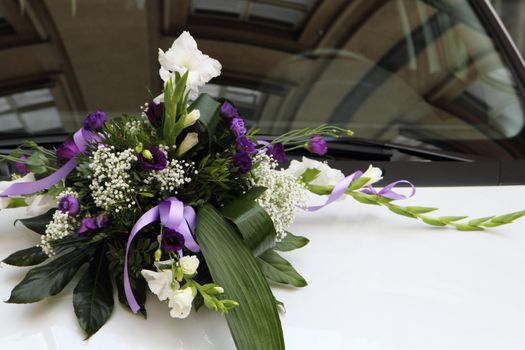 wedding flower background on the white car