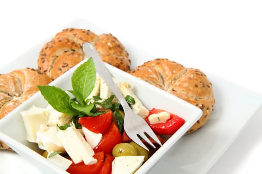 vegetable salad (tomato, basil, olive) isolated on the white background
